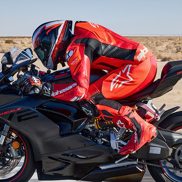 alpinestars_one-piece-suit_leather_gp-plus-v4-sprint_fluo-red-mid-red-white_lifestyle4.jpg