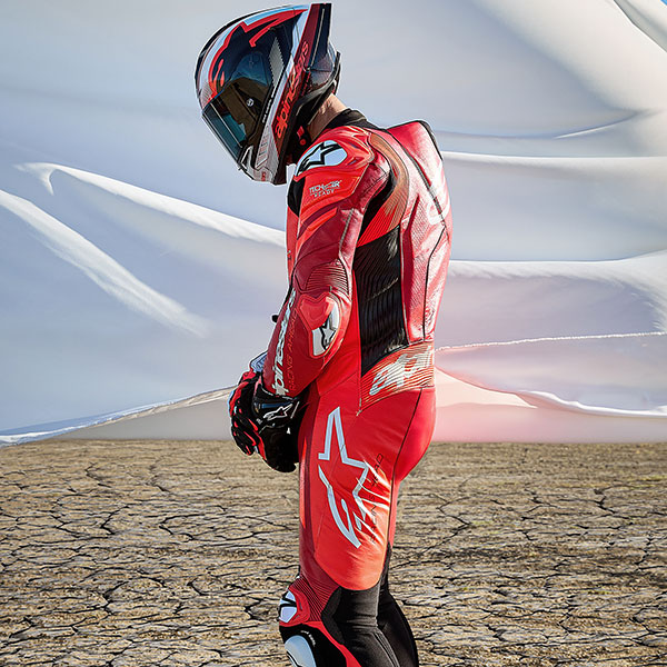 alpinestars_one-piece-suit_leather_gp-plus-v4-sprint_fluo-red-mid-red-white_lifestyle6.jpg